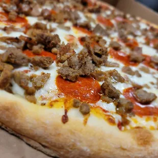 a pizza with meat and cheese