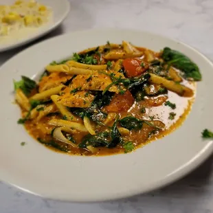 a plate of pasta and vegetables