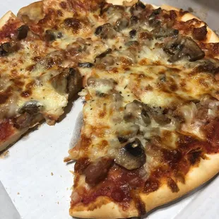 a half eaten pizza in a box