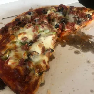 a half eaten pizza in a box