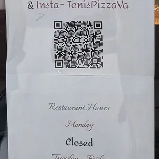 This is the menu QR code  and business hours on the door.  Photo taken January 4, 2025.