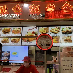 a man and a woman in front of a restaurant