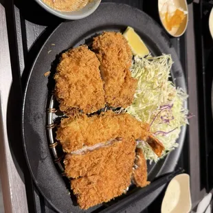 Assorted katsu couple set, includes loin, tenderloin, and shrimp katsu, along with shredded cabbage, pickled vegetables.