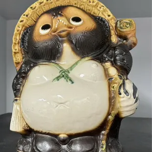 a ceramic figurine of a panda