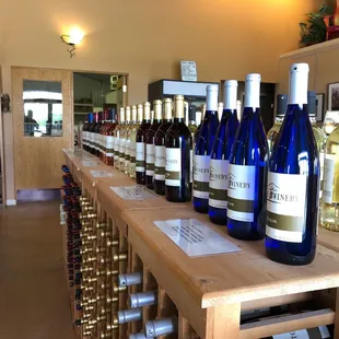 Collection of sweet wines on display as you enter.