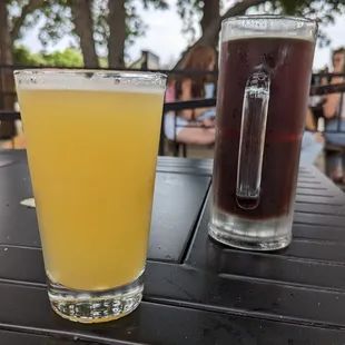 two glasses of beer on a table