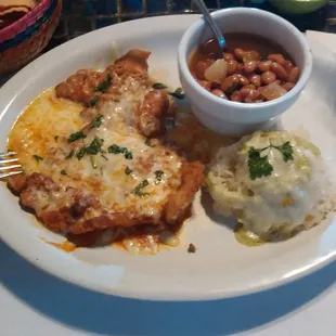 Chicken milansa al chipotle with charro beans. Usually comes with refried beans instead.