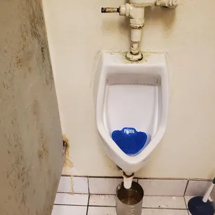 a urinal in a bathroom