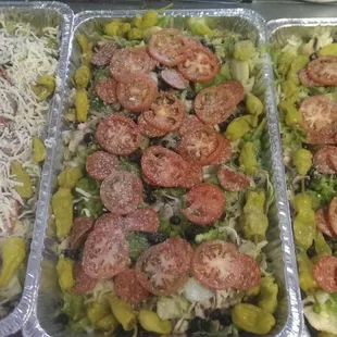 Our tray of salad will feed up to 20 people. We cater as many people as you need to feed. Dressing is included