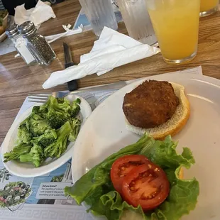 Crabcake sandwich with a side of broccoli
