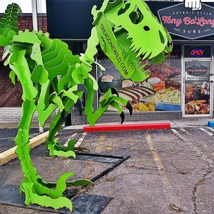 a green dinosaur statue