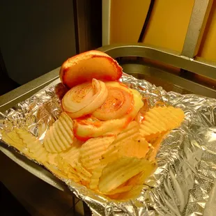 a tray of potato chips and a hot dog