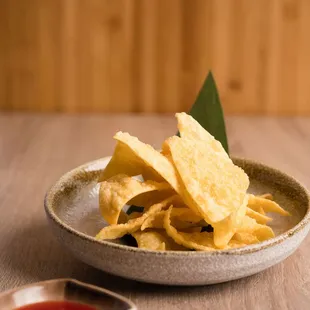 a plate of chips and dipping sauce