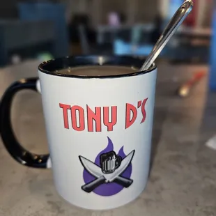 a mug with a spoon in it