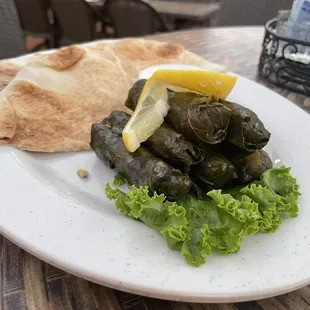 a plate of stuffed grape leaves