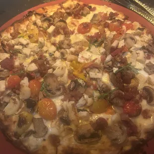 Mushroom pizza added chicken and bacon