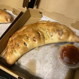 My brothers calzone. All 3 are different sizes with the same toppings.