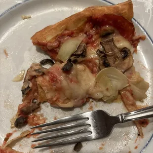 Slice of pizza I took out of the box. Crust was limp and all ingredients thrown on both sides of our 1/2 and 1/2 pizza.