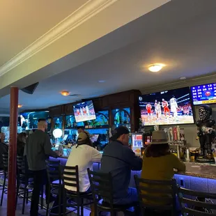 people sitting at the bar