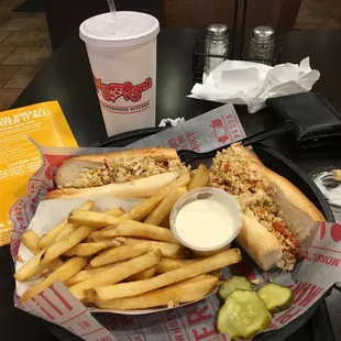 Chicken cheesesteak with hot peppers cooked in.. and a side of cheese fries.  Everything was just right!