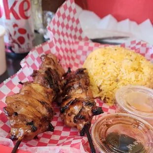 BBQ Chicken skewers with rice.. The side of papaya was good.