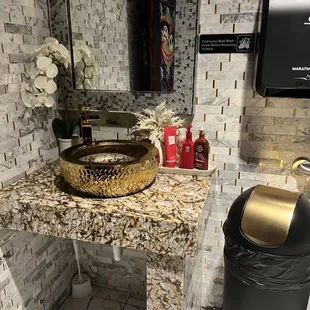 Love the gold in the bathroom