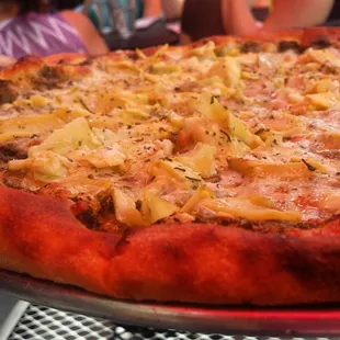 The pesto artichoke pizza is delicious.