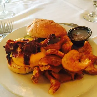 Bacon and cheddar cheese 5oz burger with pomes frittes.