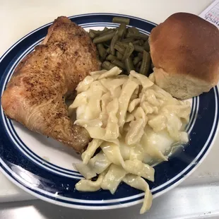 Baked chicken served with mashed potatoes topped with homemade noodles, your choice of veggie and a dinner roll $9.95