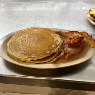 Our 3 stack of pancakes served with a meat of your choosing for $8.99