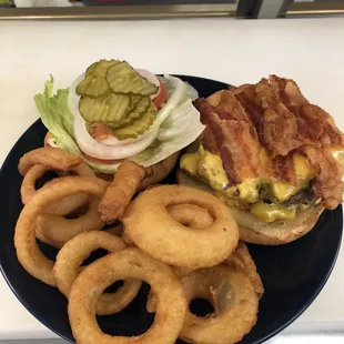 Double bacon cheese burger with the works served alongside crispy onion rings $15.99