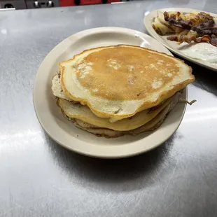 Three pancakes with a choice of meat $8.99 
Add blueberries or chocolate chips for $1.50