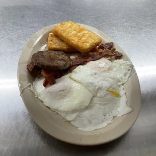 Big Mike's Breakfast three Eggs, Bacon and Sausage, Homefries, Toast, and a half order of biscuits and gravy $14.99
