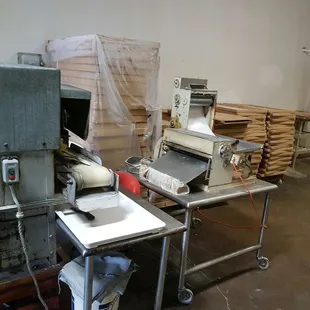 a kitchen with a table and a machine