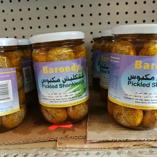 three jars of pickled olives