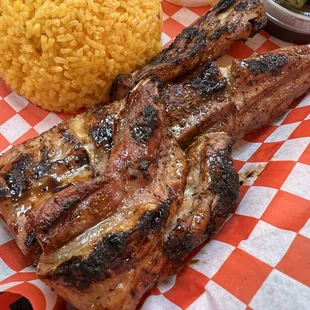 Grilled tuna belly with yellow rice.