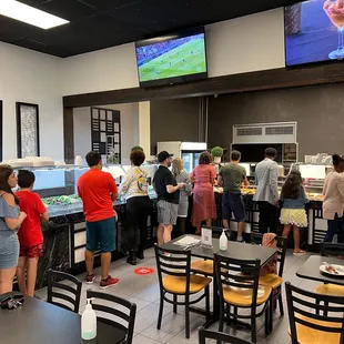 a large group of people in a restaurant