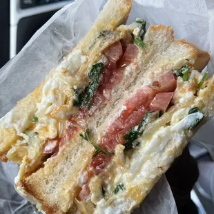 Egg white &amp; cheese, spinach, tomato, fried onion, Mayo. On white toast. So good.