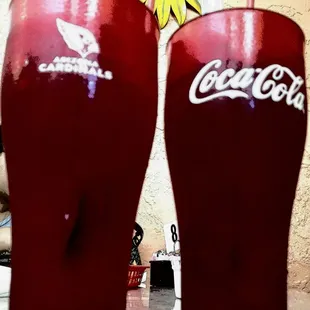 two coke glasses on a table