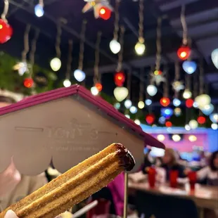 Churro with chocolate sauce