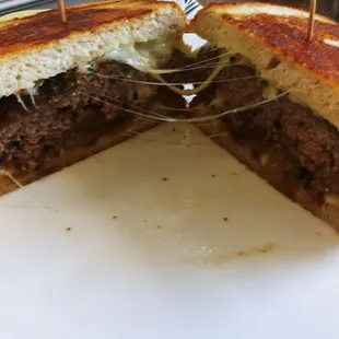 a cheeseburger cut in half