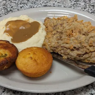 Chicken Fried Steak without gravy, Mashed Potatoes with beef gravy, cornbread and jalapeno cornbread.