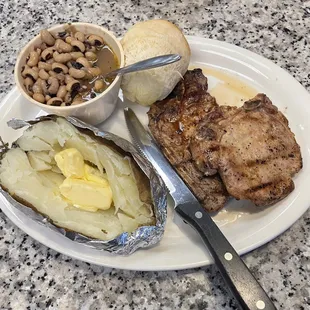 Two grilled Pork Chops  w/ 2 sides ... $13.95