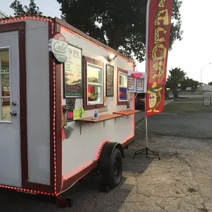 a food truck with lights on