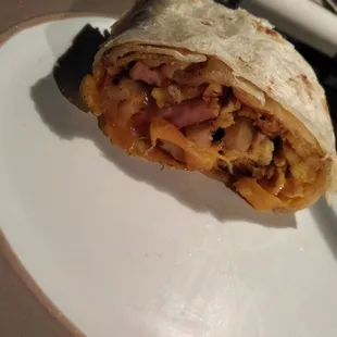 Section of ham breakfast burrito Burritos don&apos;t belong in photos