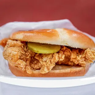 a chicken sandwich with pickles