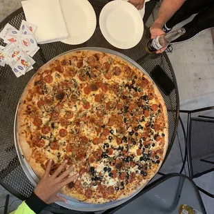 a pizza being served