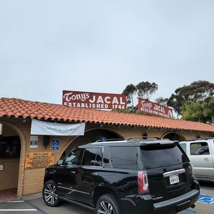 a car parked in front of a restaurant