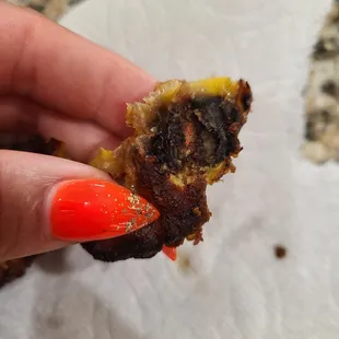 Inside the plantain. It is terrible that this establishment would serve this food to its supportive community. I will never eat here again.