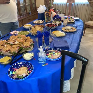Tony&apos;s croissant party tray, delicious guacamole and their own brand tortilla chips, fruit, cheeses, salami and sweet raspberry cookies!